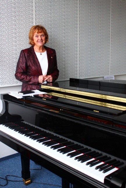 Mrs. Dagmar Petrofová, the Head of PETROF Pianosalon, with PETROF pianos bought by Conservatory.